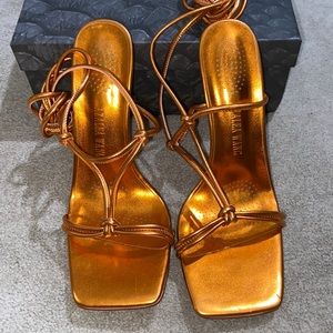 Metallic orange heels
